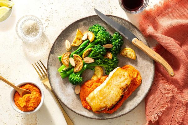 Steaks and romesco with baby broccoli, summer squash, and almonds