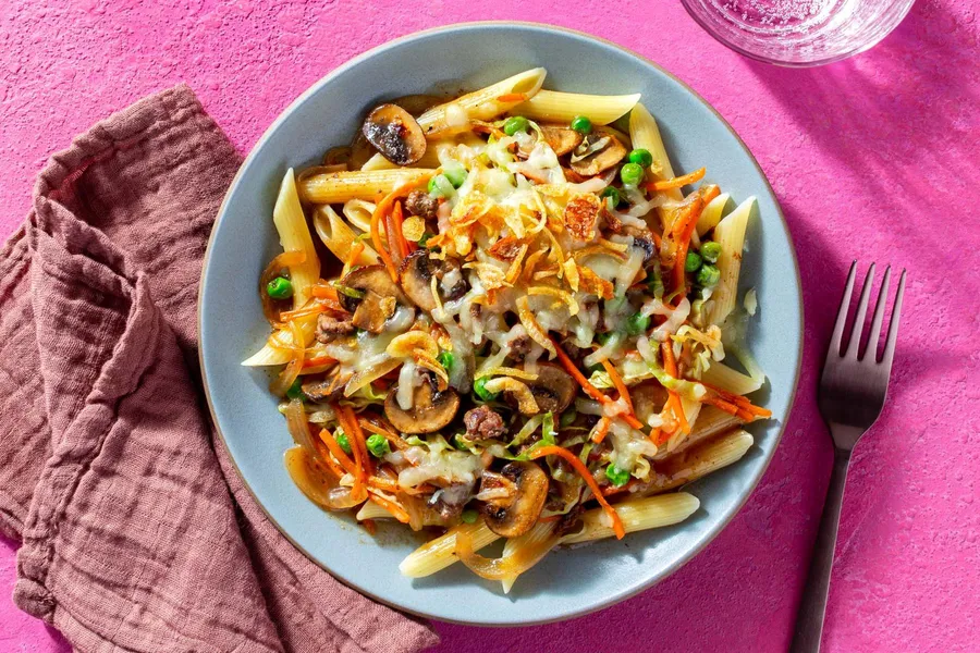 French onion beef penne with mushrooms, cabbage, and melted Gruyère