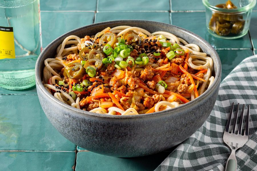 KoreanInspired Ramen Bowl with Spicy Pork, Carrots, and Cabbage