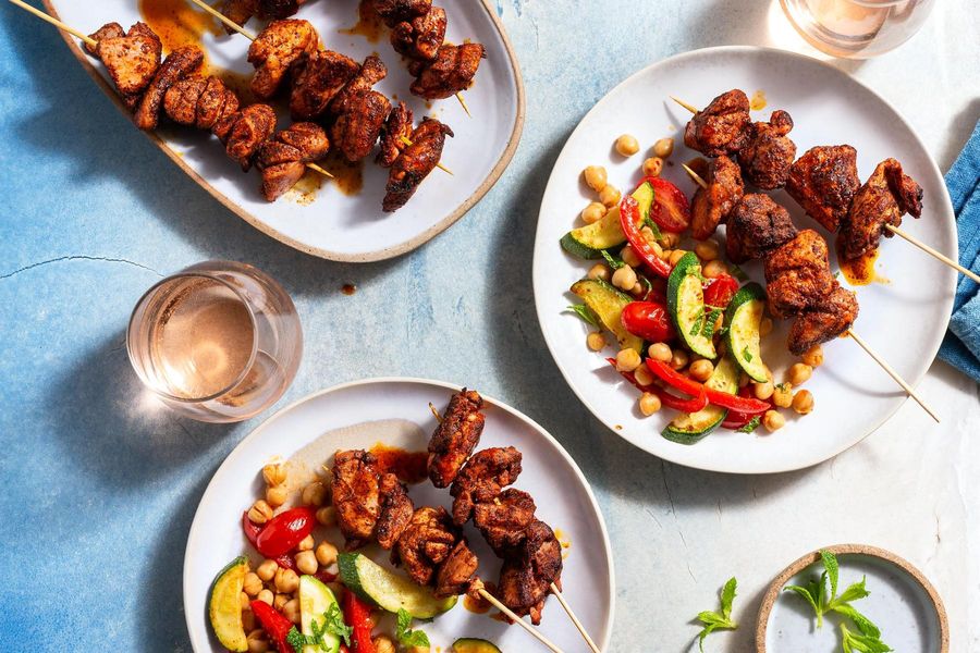Moroccan-spiced chicken skewers with chickpea and tomato salad