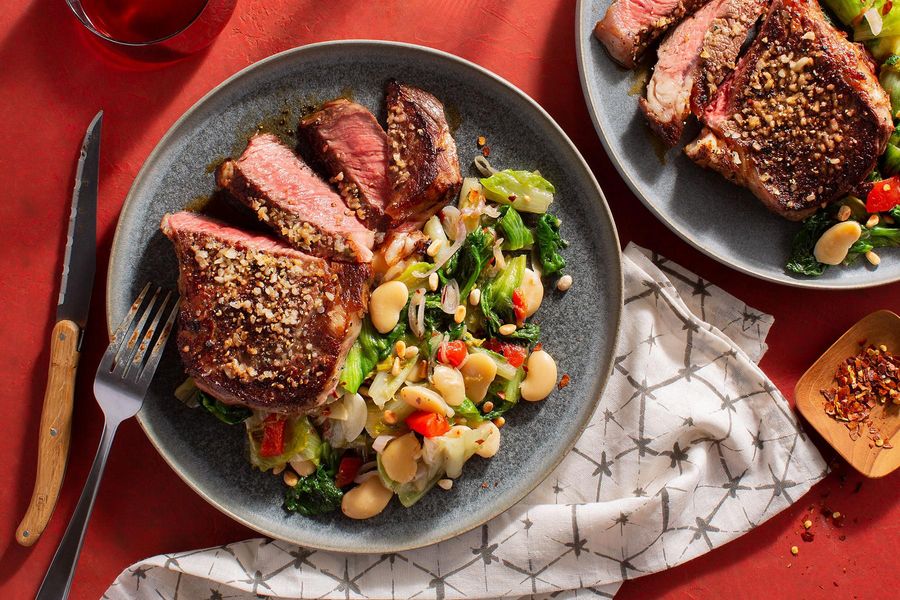 Black Angus steaks with Parmesan, braised chicories, and white beans
