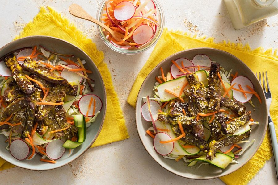 Lemongrass beef over “zoodles” with pickled radishes and carrots