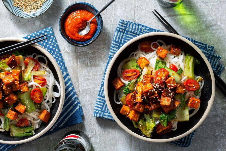 Five-spice tofu stir-fry with flat rice noodles, tomatoes, and bok choy