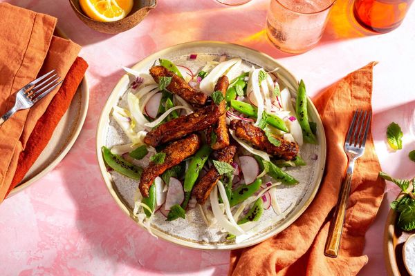 Fennel-spiced pork over snap pea and radish salad