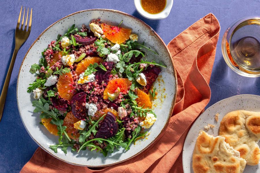 Beet and quinoa salad with orange, goat cheese, and toasted naan