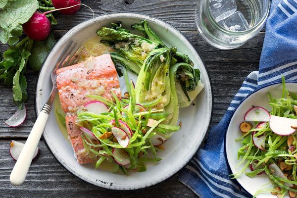 Baked salmon with bok choy and snow pea-radish slaw