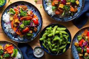 Orange-glazed tofu with bell peppers, broccoli, and jasmine rice