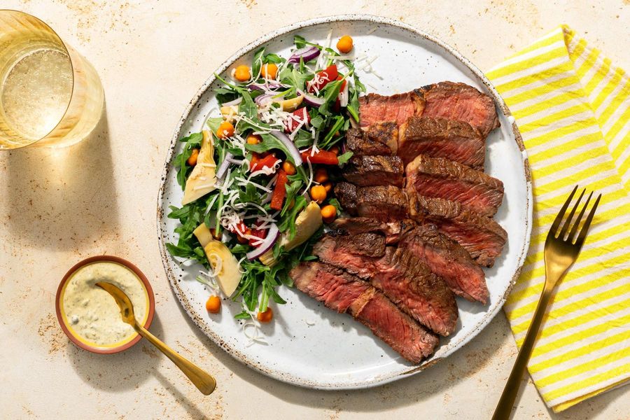 Black Angus steaks with chickpea, artichoke, and roasted red pepper salad