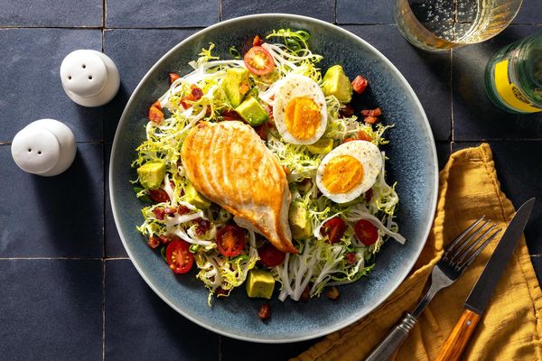Frisée salad with pancetta, avocado, and soft-cooked eggs