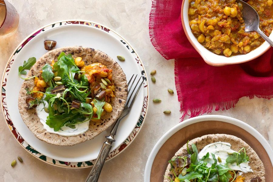 Whole grain pita with curried chickpeas and arugula-date salad