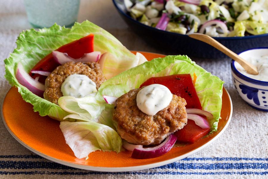 Lettuce-wrapped turkey sliders with basil mayo and black bean salad