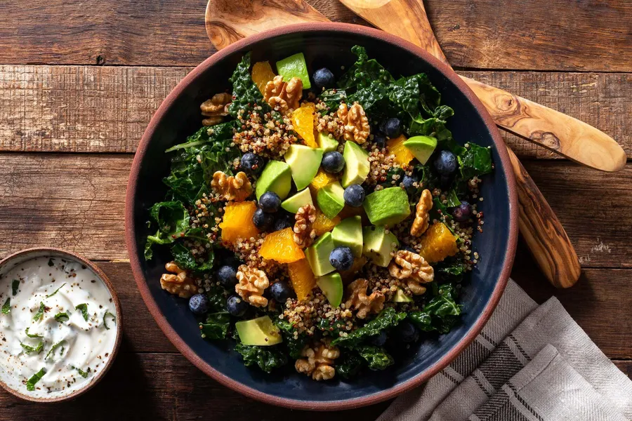 Superfood salad with quinoa, orange, blueberries, and walnuts