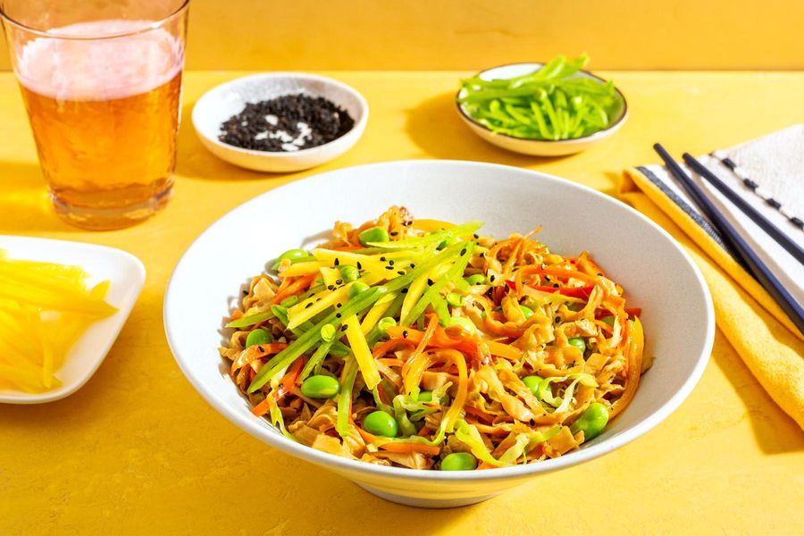 Spicy yuba noodle stir-fry with citrus-miso dressing and mango