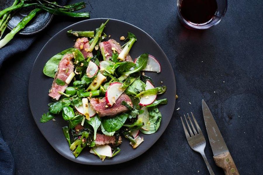 Steak salad with charred scallions and kimchi-spiced dressing 