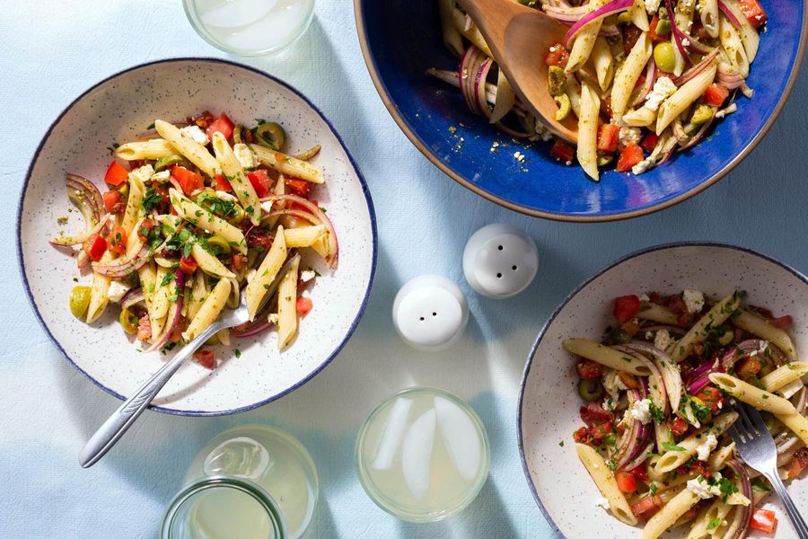 Fresh pasta salad tricolore with pancetta, feta, and Italian dressing