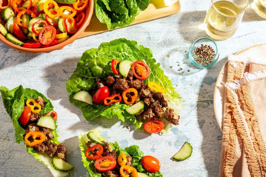 Greek lamb lettuce cups with sweet mini peppers, cucumber, and tomatoes