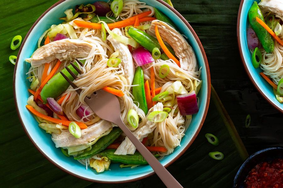 Pancit bihon noodle stir-fry with chicken and vegetables