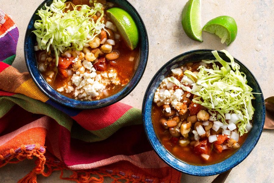 Pinto bean and hominy pozole rojo with queso fresco