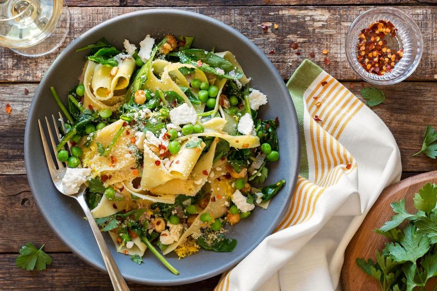 Pappardelle with wilted greens, hazelnuts, and ricotta salata