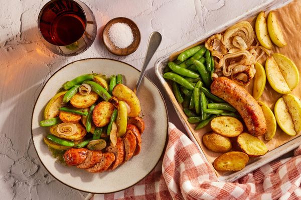 Sheet pan sausages, apple, and vegetables with dill vinaigrette