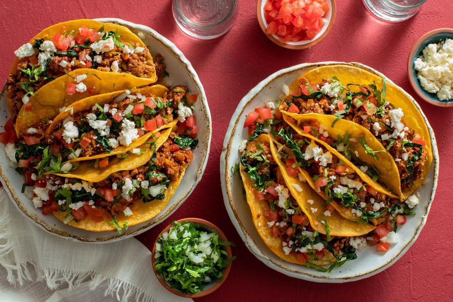Street tacos with kale, tomato, and queso fresco