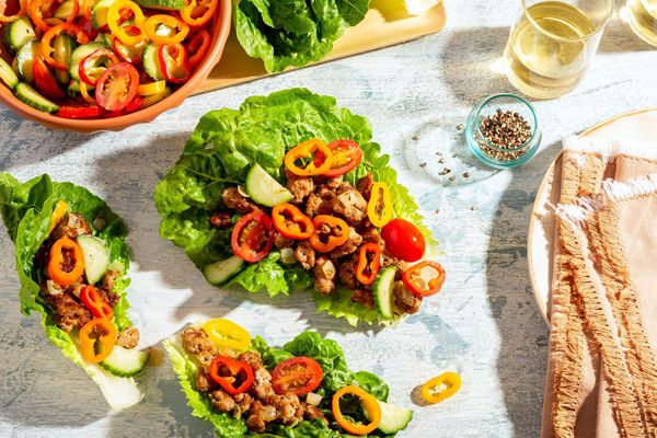 Greek lamb lettuce cups with sweet mini peppers, cucumber, and tomatoes