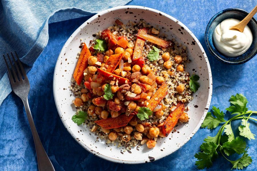 Braised chickpeas and carrots with quinoa, yogurt, and almonds