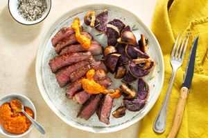 Black Angus steaks with purple sweet potatoes and red pepper salsa
