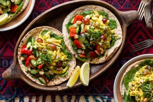 Curried chicken salad with grapes, smashed cucumber, and pita