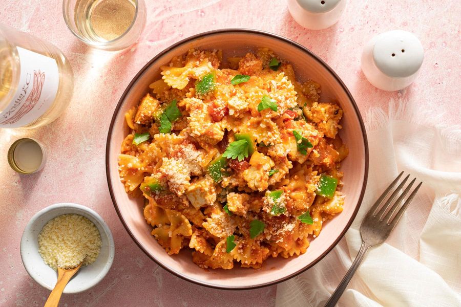 American chop suey with your choice of protein and pasta in tomato sauce