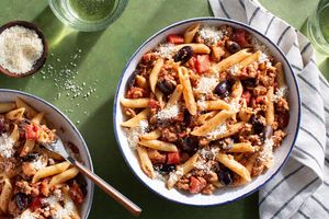 Penne rigate with ground chicken, tomato-olive sauce, and fresh ricotta