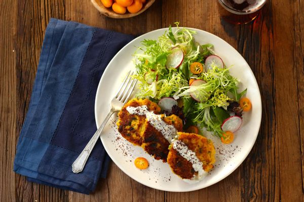 Cauliflower fritters with lemon yogurt and tangy mixed green salad