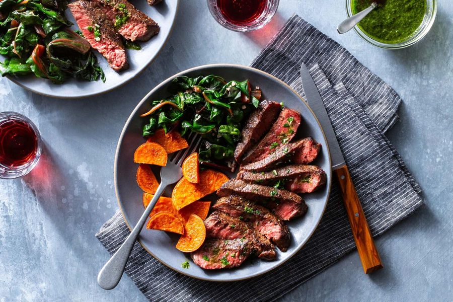 Steaks with chimichurri and harissa-roasted sweet potatoes