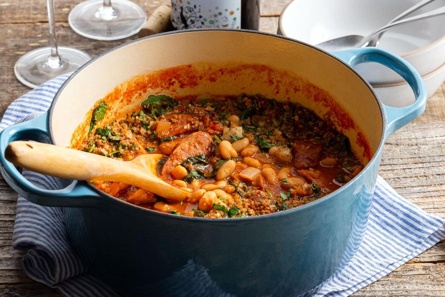 Sausage and white bean cassoulet with kale and roasted garlic