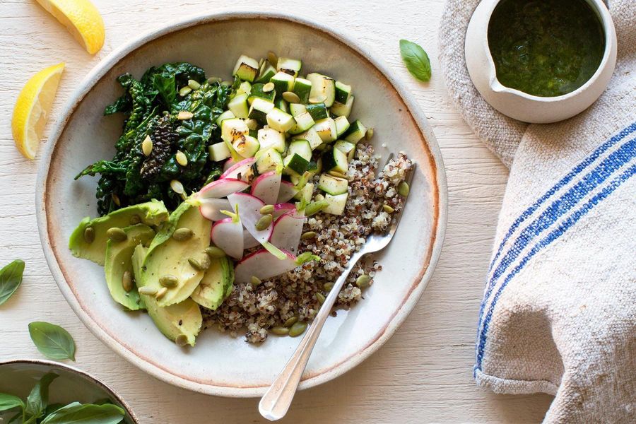 Quinoa bowl with kale, avocado, and basil-mint pesto