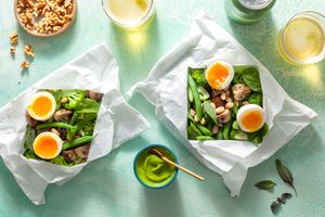 Vegetables in parchment with green goddess dressing and soft-cooked eggs