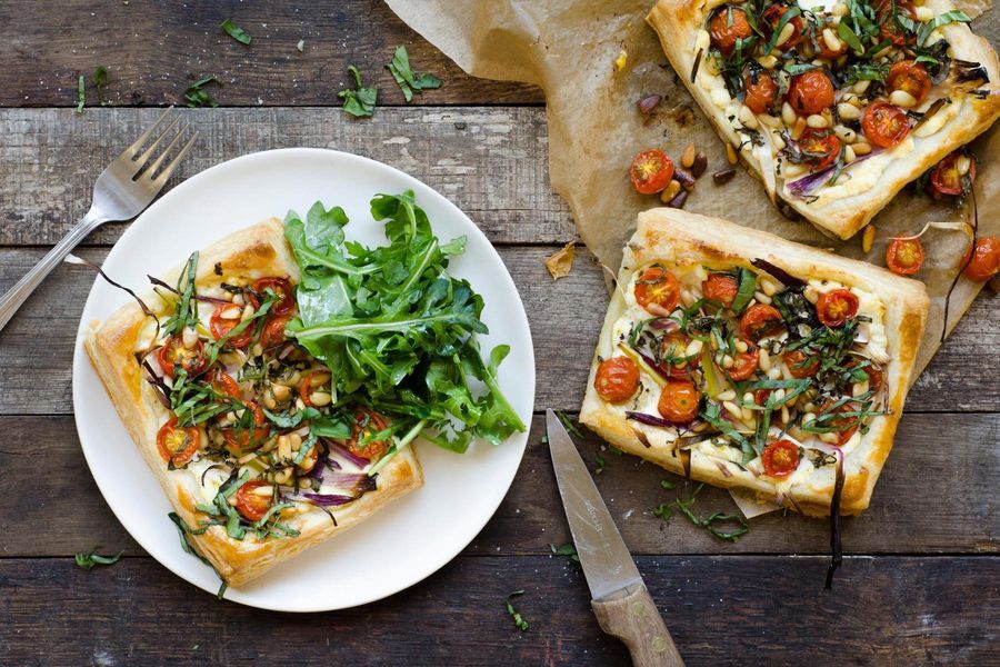 Spring onion, cherry tomato and lemon ricotta tarts with arugula salad