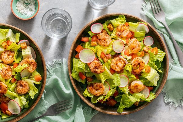 Chipotle shrimp and Cajun-spiced potatoes over romaine salad