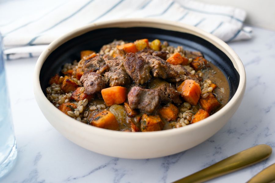 Slow cooked beef and roasted root vegetables bowl