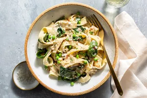 Veggie pappardelle al limone with spinach and sweet peas