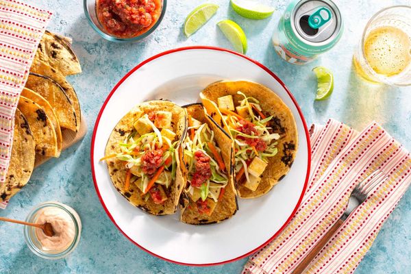 Salmon tacos with cabbage slaw, salsa roja, and chipotle yogurt