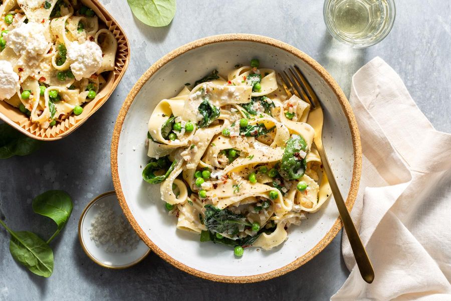 Pappardelle with wilted spinach, sweet peas, and fresh ricotta
