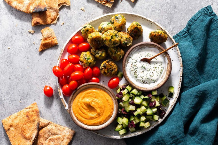 Greek meze platter with chicken keftedes and lemon-dill yogurt