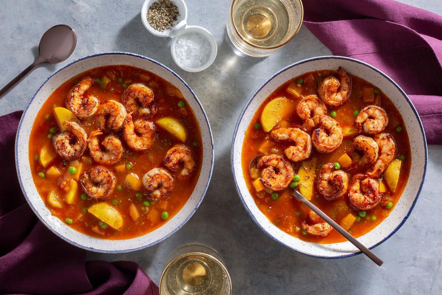 Spanish shrimp soup with potatoes, peas, and smoked paprika