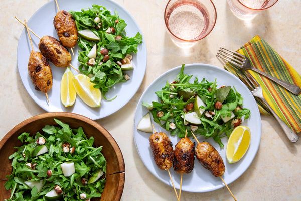 Greek beef skewers with arugula-pear salad and hazelnuts