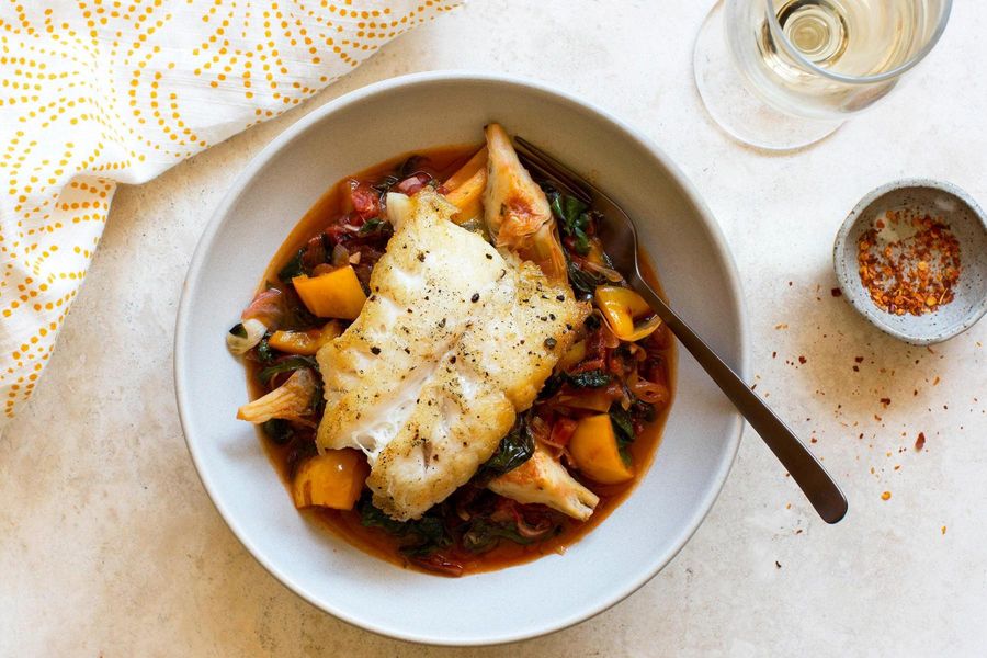 Pan-roasted Pacific cod with braised bell pepper, artichokes and tomato 