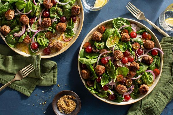 Kefta-spiced meatballs with spinach-grape salad and pumpkin seed dukkah