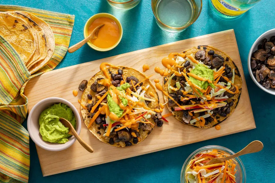 Five-spice black bean and cremini tacos with guacamole and crunchy slaw