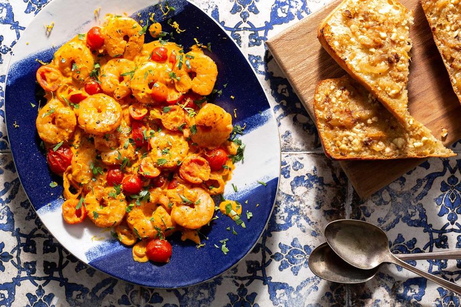 Greek shrimp with roasted red pepper sauce and garlic-feta toasts