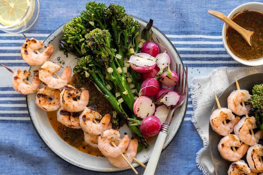 Shrimp skewers and grilled baby broccoli with red chermoula